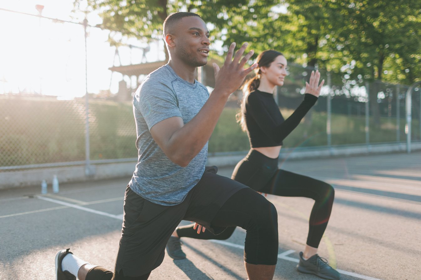 Diverse Athletic Couple Exercising Outdoors